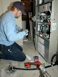 man providing maintenance on HVAC system